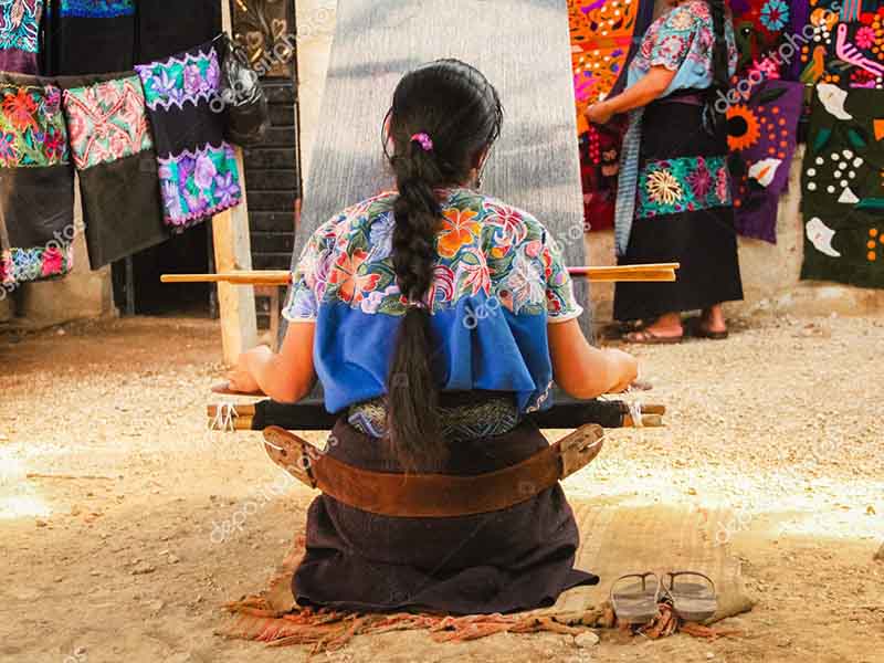 Mexican woman working loom in Chiapas Mexico